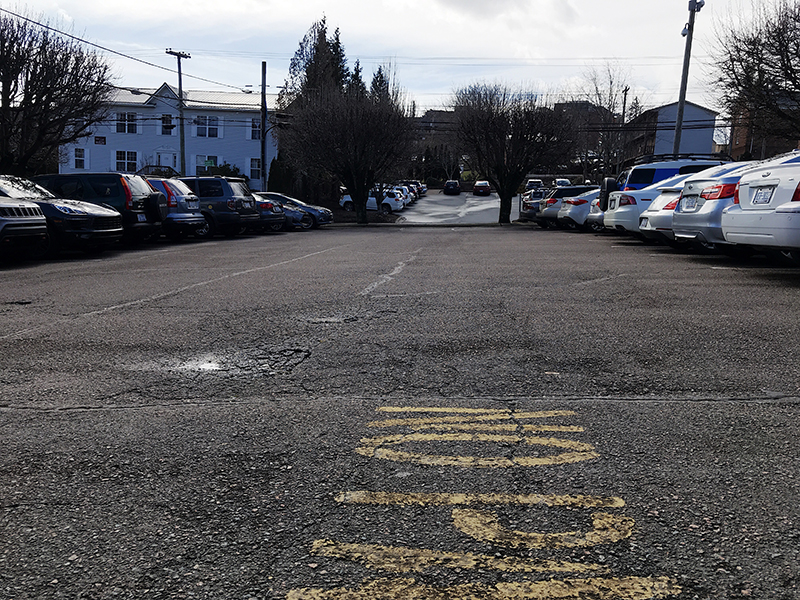 The King / Cherry Street parking lot is located right off of King street with the an entrance off of Cherry Drive. The Avent Rock Church is on the other corner of the same side of the street.  This lot is lighted and paved.